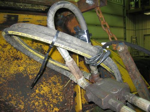 Brusher skidsteerca bypass loop and relief valve.JPG