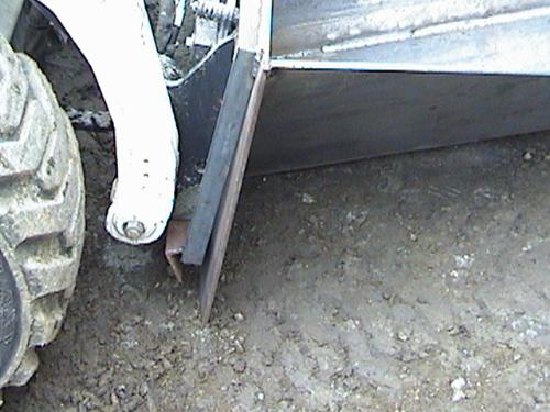 Root and Ditch Bucket Warped Backplate.JPG